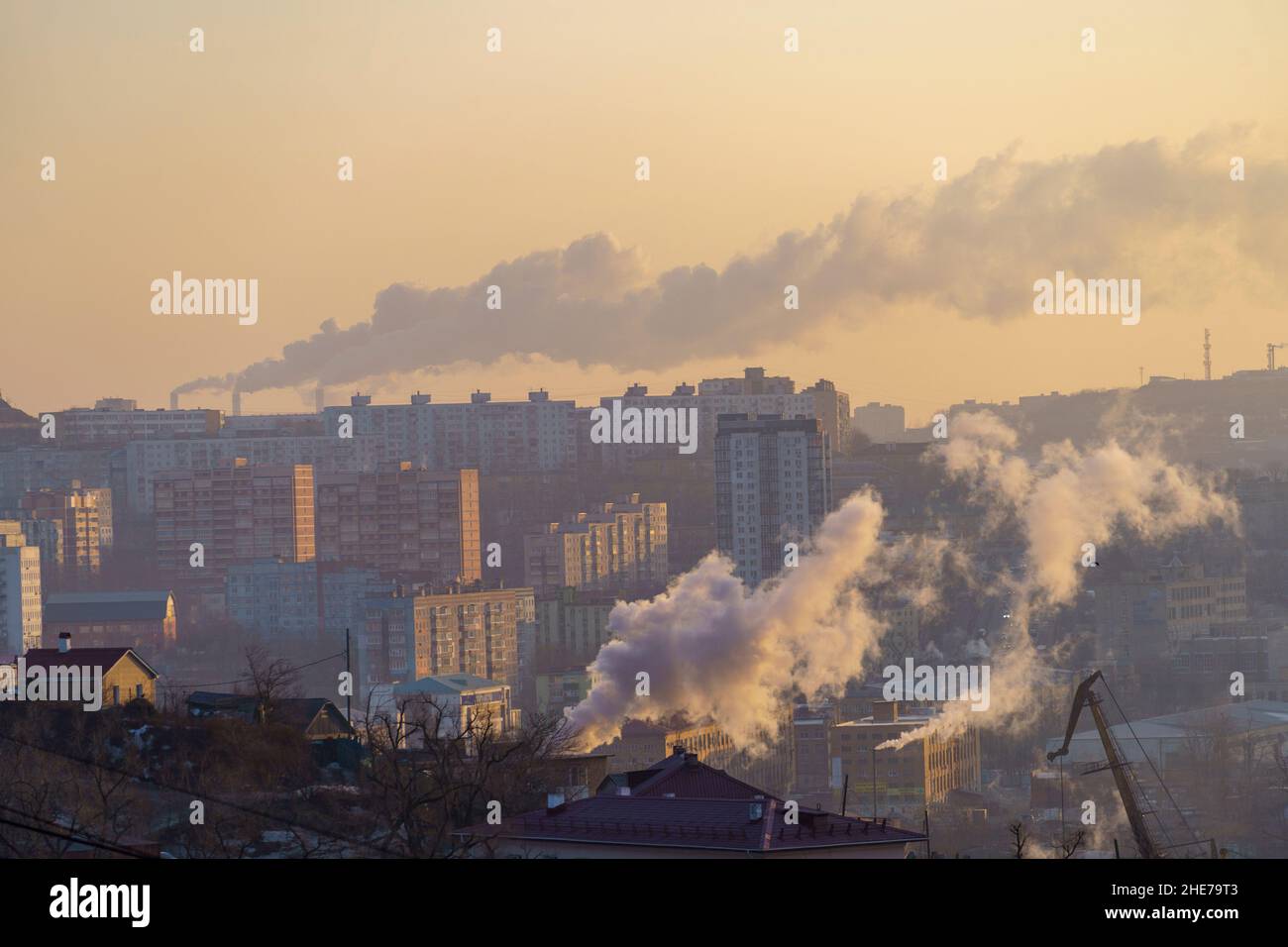 Urban landscape with smoke from heating systems. Vladivostok, Russia Stock Photo