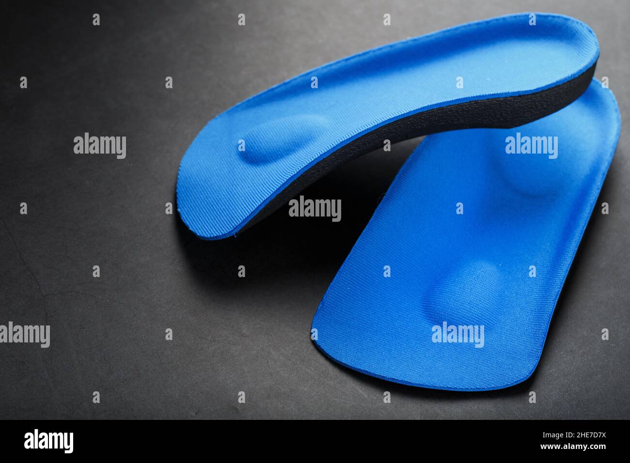 Orthopedic insoles for correction of pronation of the foot on a dark