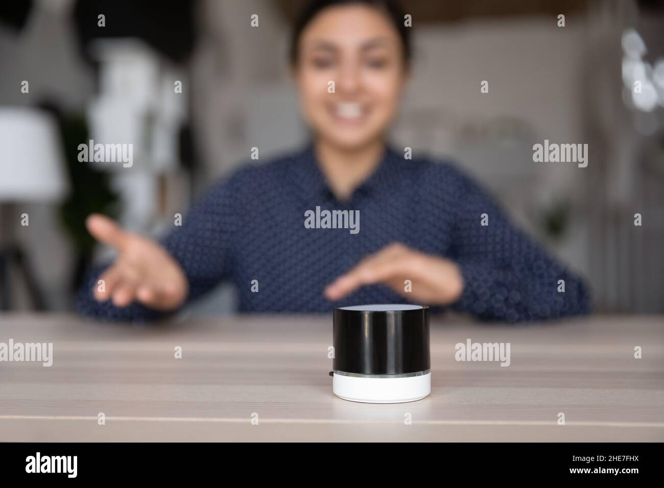 Small portable speaker for voice assistance app using Stock Photo