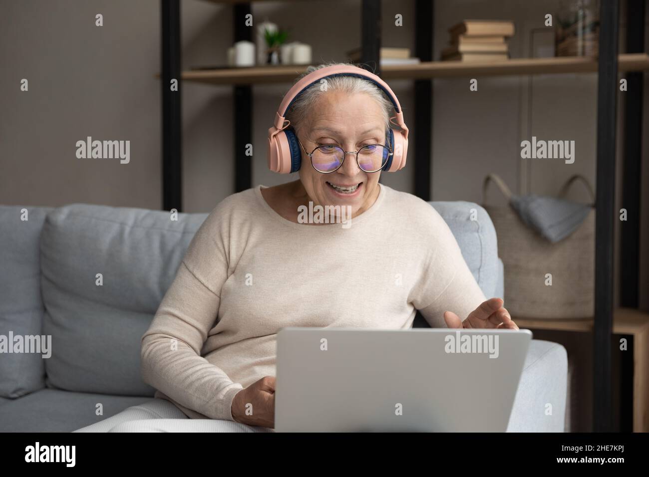 Happy middle aged woman holding video call conversation Stock Photo - Alamy