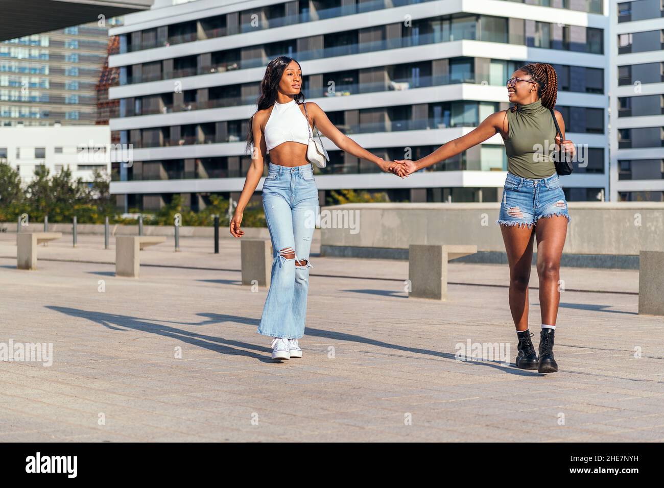 African girls holding hands hi-res stock photography and images - Alamy