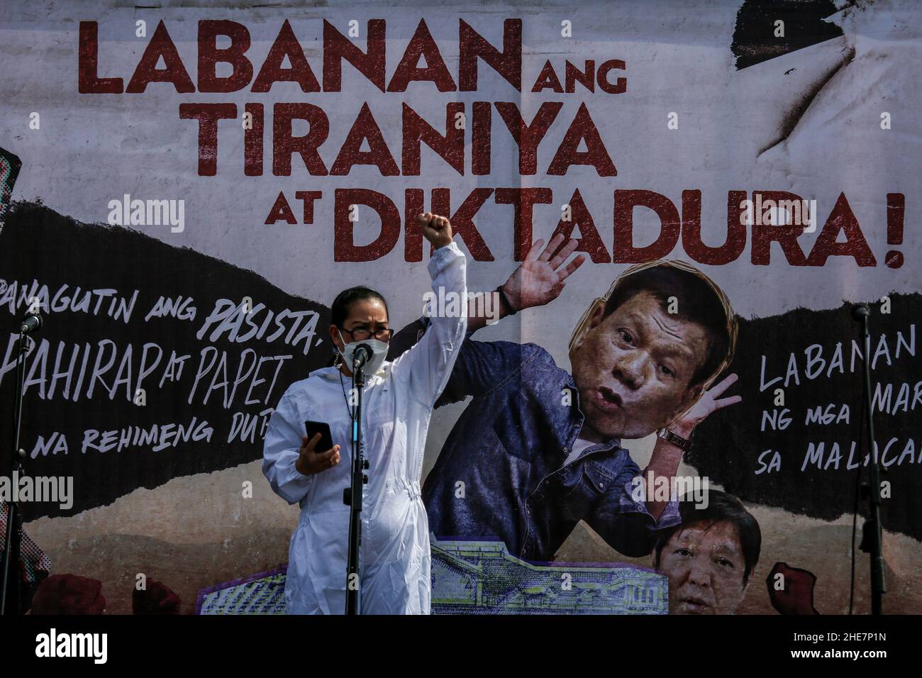 Protesters carry signs during a protest to mark the 73rd International Human Rights Day at the University of the Philippines in Quezon City, Metro Manila. Thousands of activists from various groups rallied against the implementation of the controversial anti-terror law and alleged human rights violations, including attacks on media workers and alleged extrajudicial killings in President Duterte's crackdown against illegal drugs. Philippines. Stock Photo