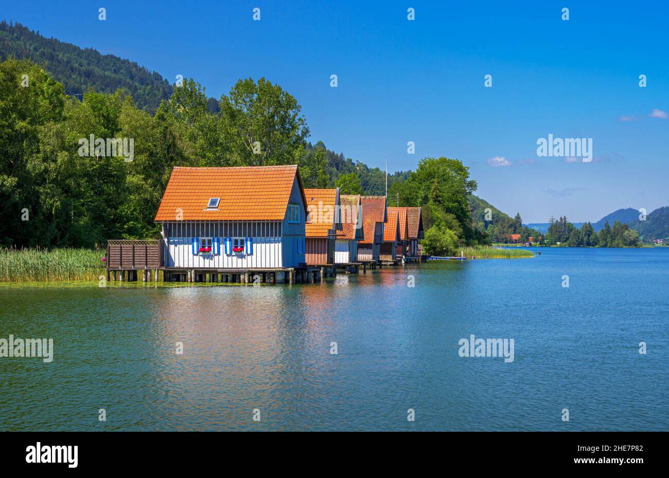 Boathouses on Grosser Alpsee, Allgäu, Bavaria, Germany Stock Photo