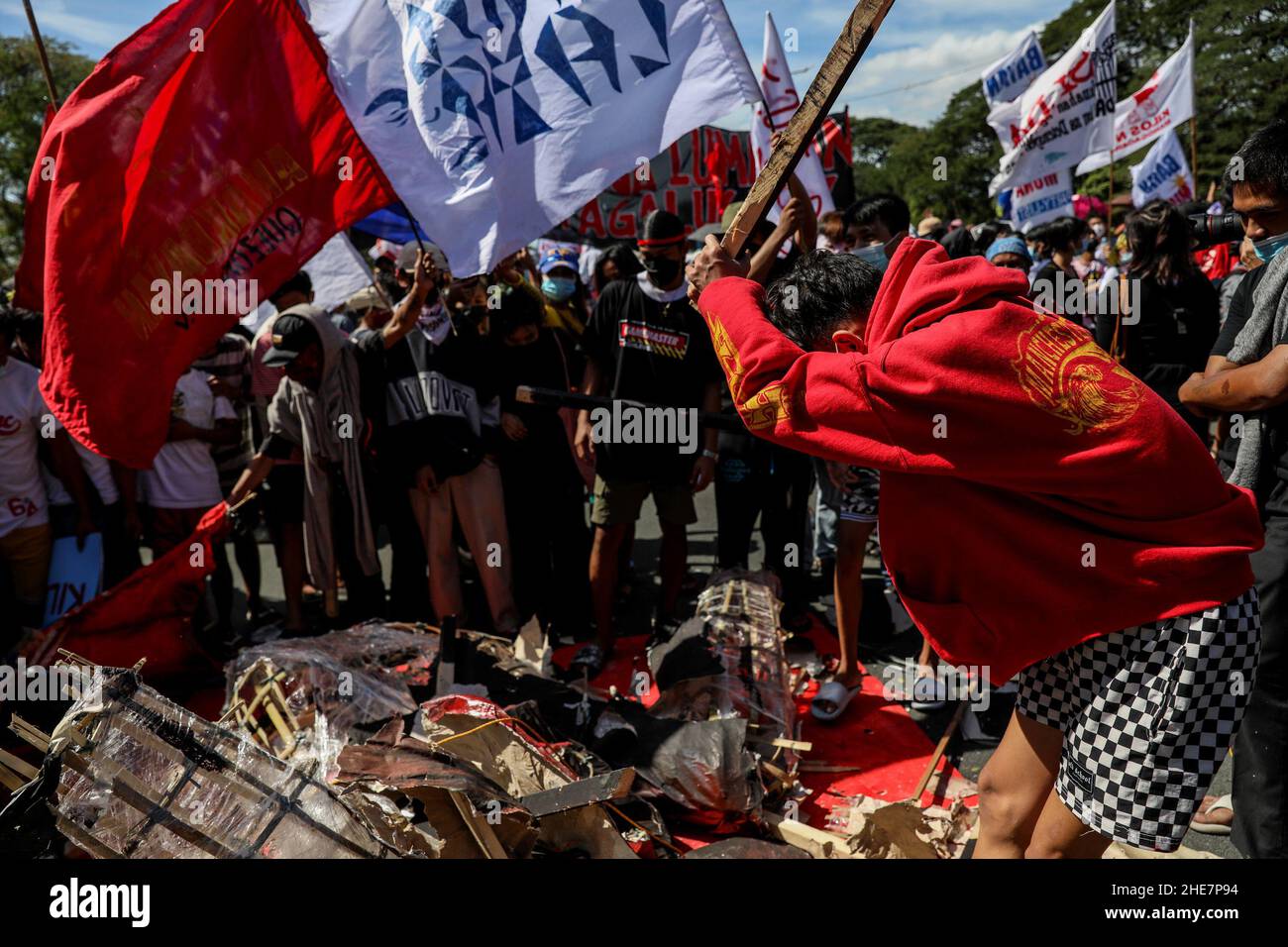Protesters destroy an effigy of Philippine President Rodrigo Duterte during a protest to mark the 73rd International Human Rights Day at the University of the Philippines in Quezon City, Metro Manila. Thousands of activists from various groups rallied against the implementation of the controversial anti-terror law and alleged human rights violations, including attacks on media workers and alleged extrajudicial killings in President Duterte's crackdown against illegal drugs. Philippines. Stock Photo