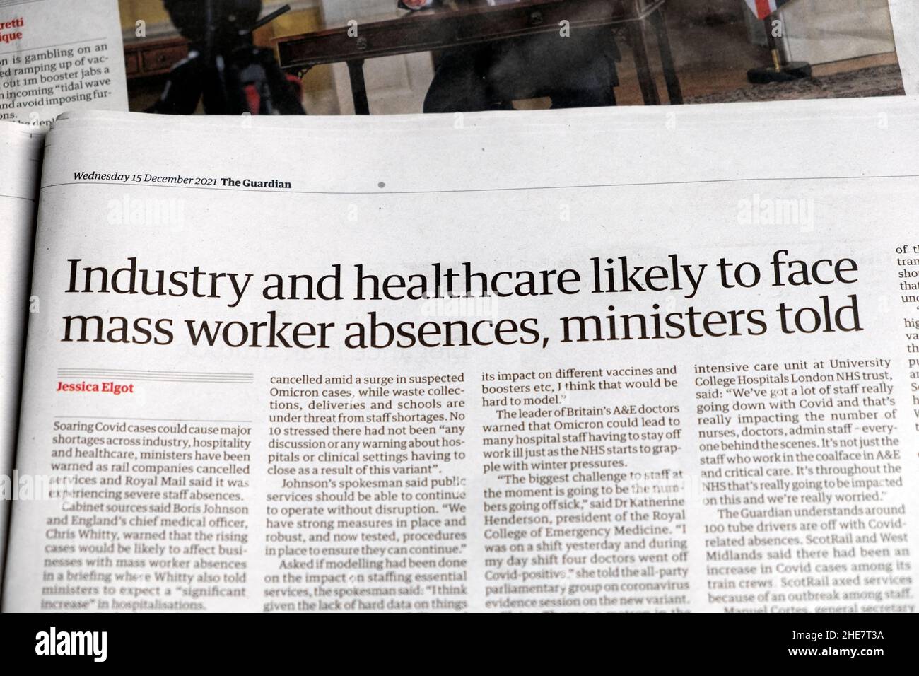 'Industry and healthcare likely to face mass worker absences, ministers told' Guardian newspaper headline healthcare clipping news 15 December 2021 Stock Photo