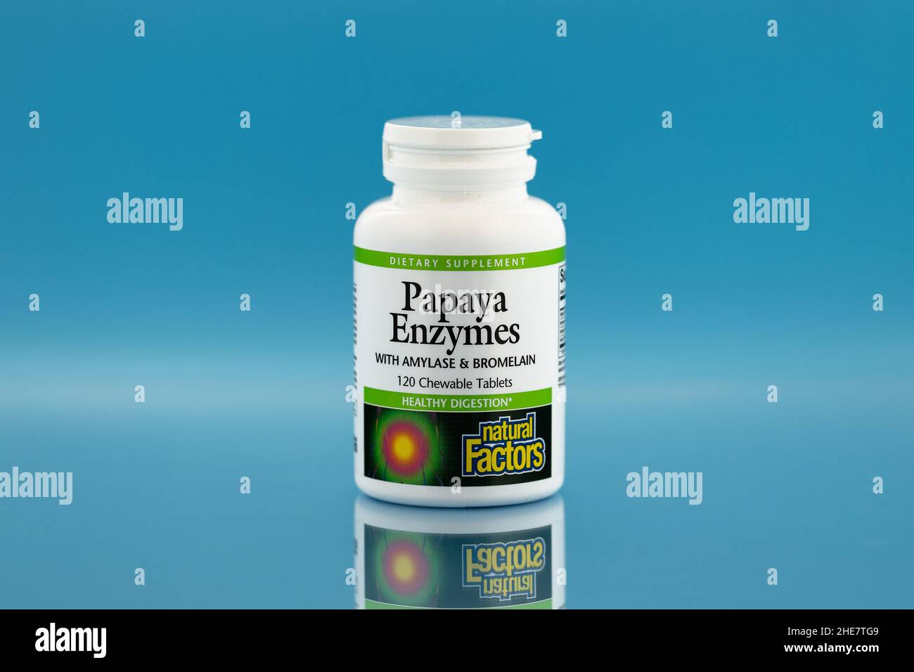 papaya enzymes capsules in the jar. dietary supplement editorial photo