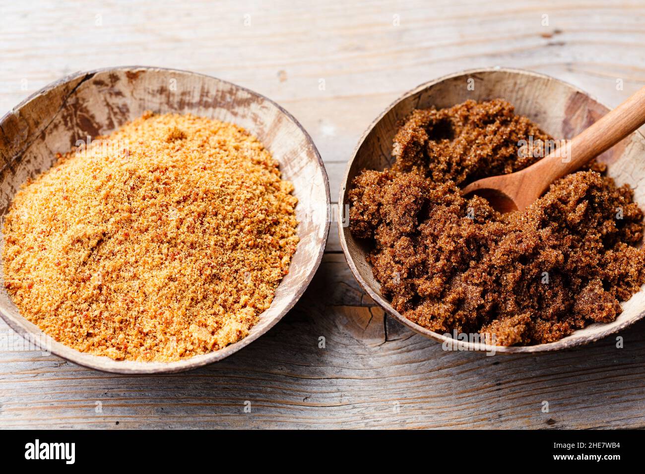 soft brown dark sugar and unrefined sugar cane in bowls Stock Photo