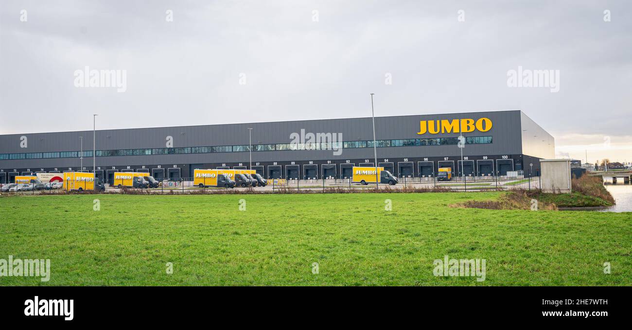 Huge distribution center with many docks of Jumbo, a Dutch international discount supermarket chain. Stock Photo