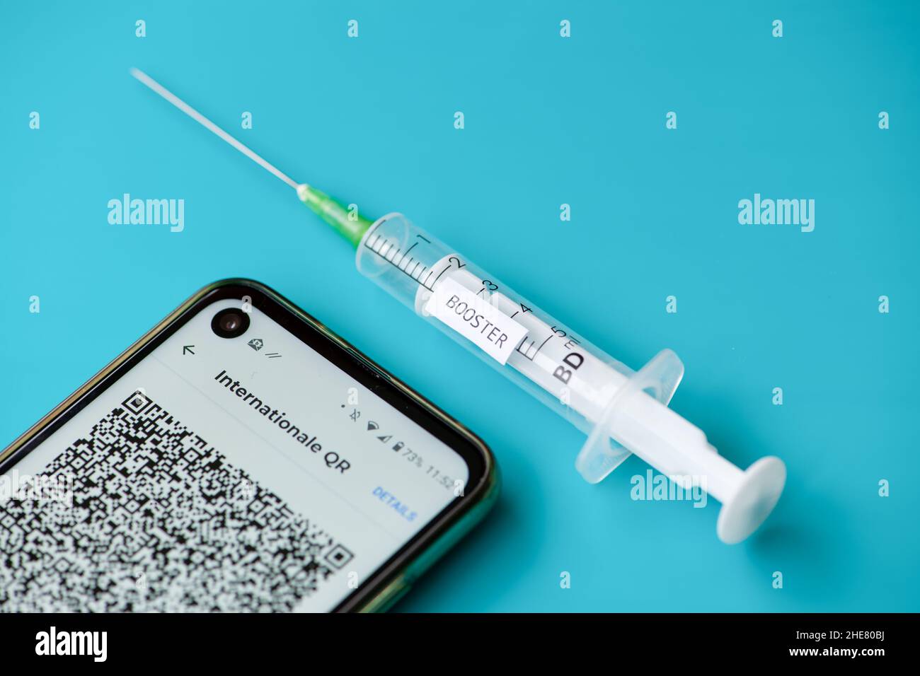 Booster vaccination and QR code Stock Photo - Alamy