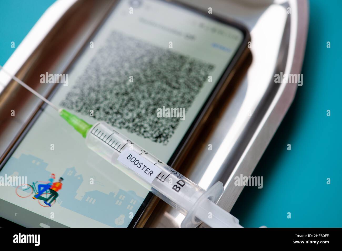Booster vaccination and QR code Stock Photo - Alamy