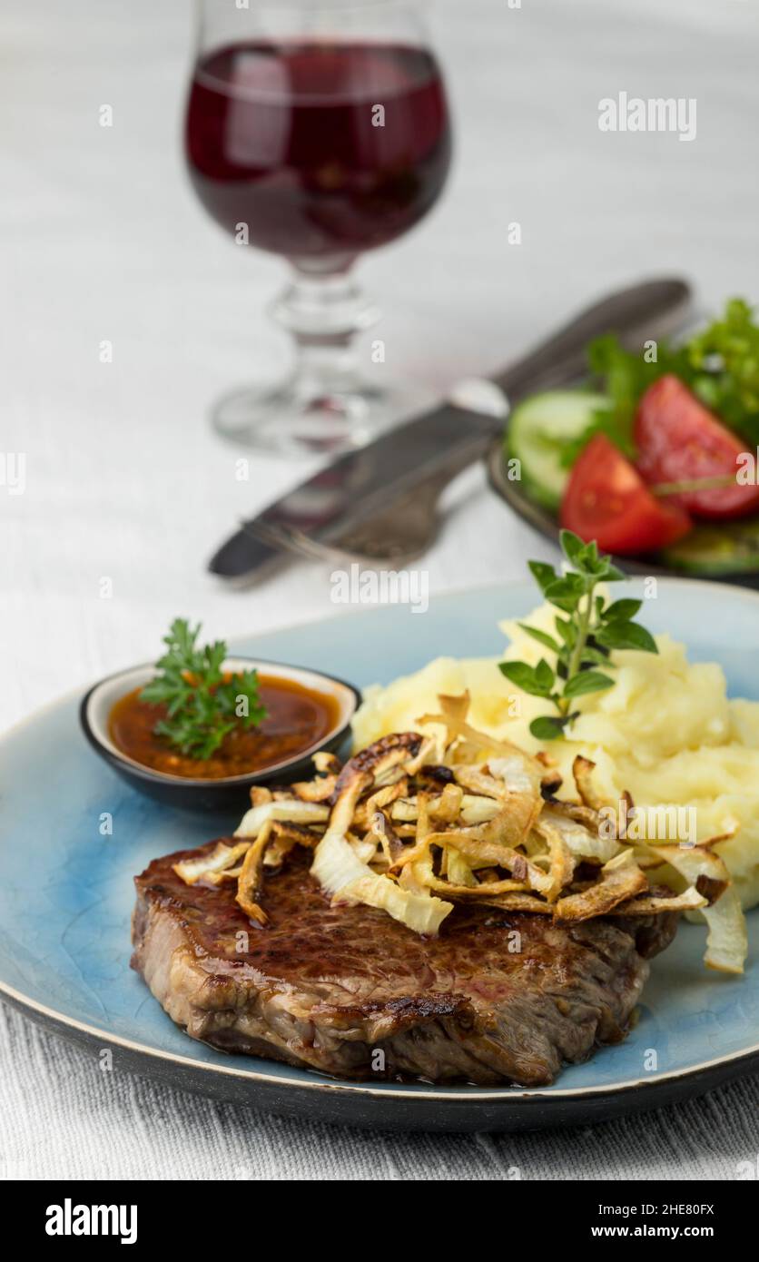 german steak with roasted onions Stock Photo Alamy