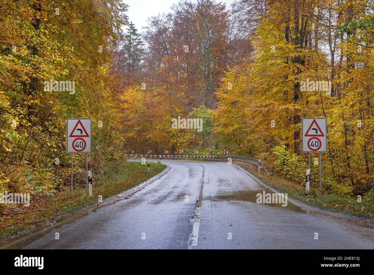 Curve of a wet country road in the rain Upper Bavaria, Bavaria, Germany Stock Photo