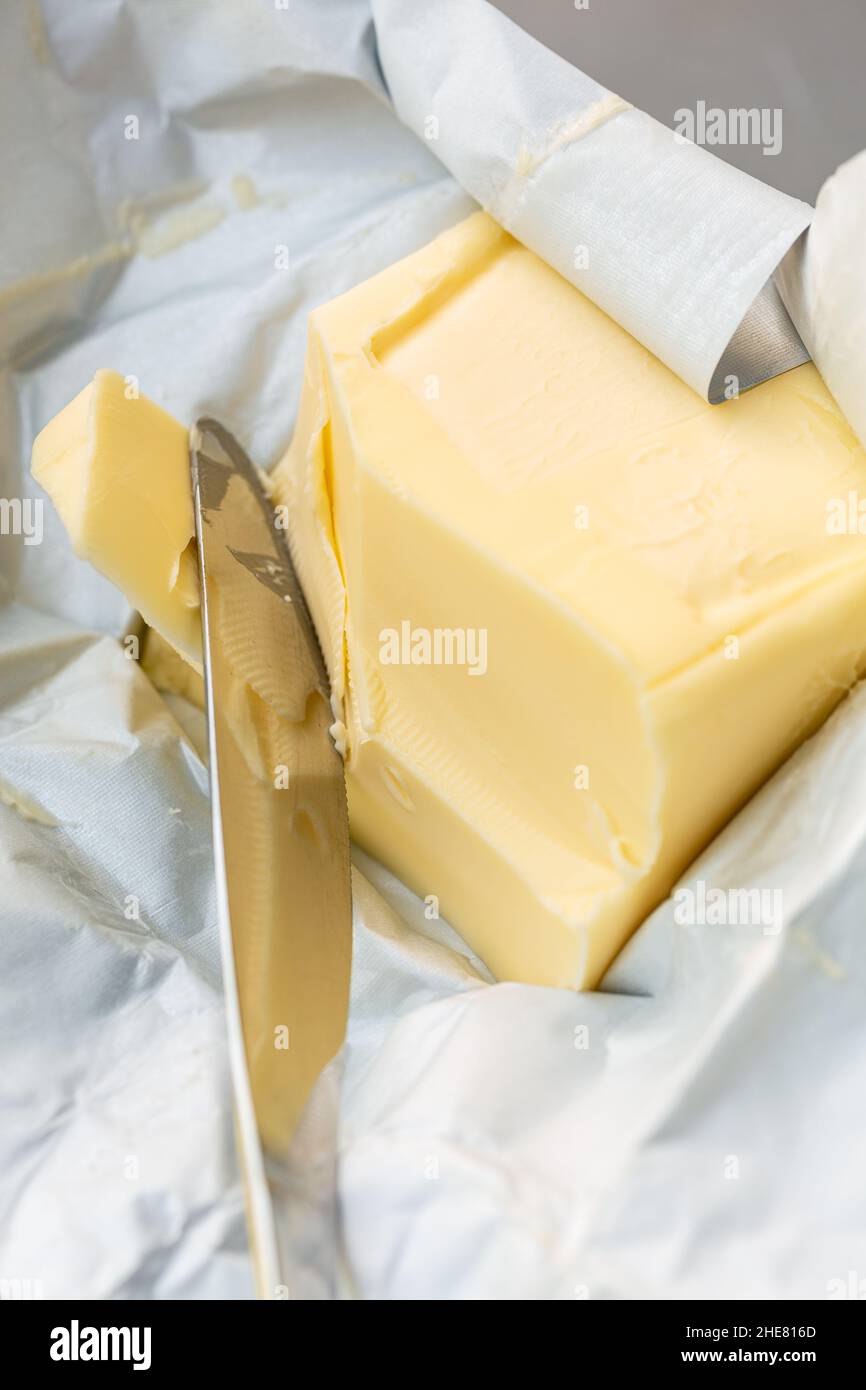 Butter being spread with a knife Stock Photo Alamy