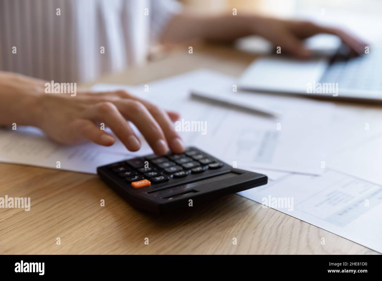 Hand of African finance professional woman using calculator Stock Photo