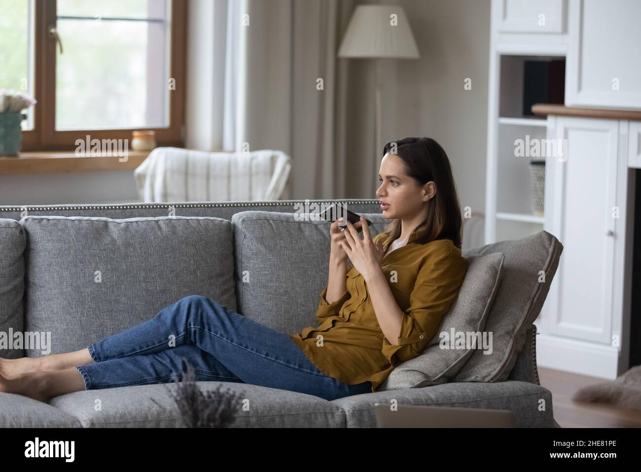 Focused millennial professional woman having mobile phone call on ...