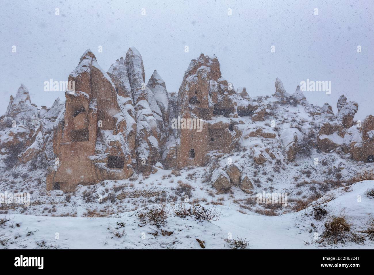Heavy snowfall in Cappadocia. Large flakes of snow fall from the sky and cover the entire incredible landscape Stock Photo