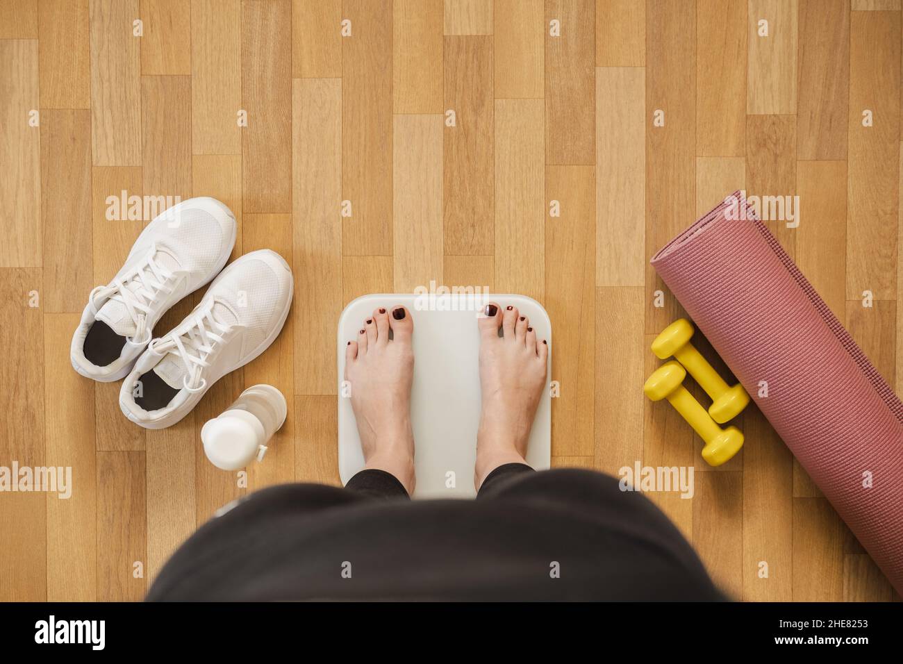 Female foot takes a step on smart scales that makes bioelectric impedance  analysis, BIA, measurements of body fat Stock Photo - Alamy