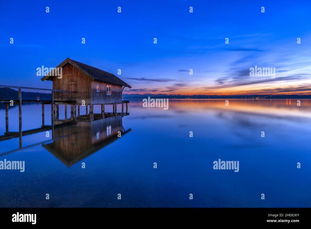 Boathouse at twilight on Ammersee, Bavaria, Germany Stock Photo