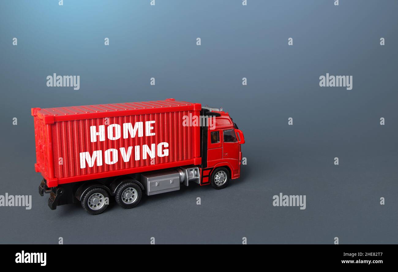 Home moving truck transporting company. Delivery services to another house. Relocation to a new housing. Transportation and delivery of things and fur Stock Photo