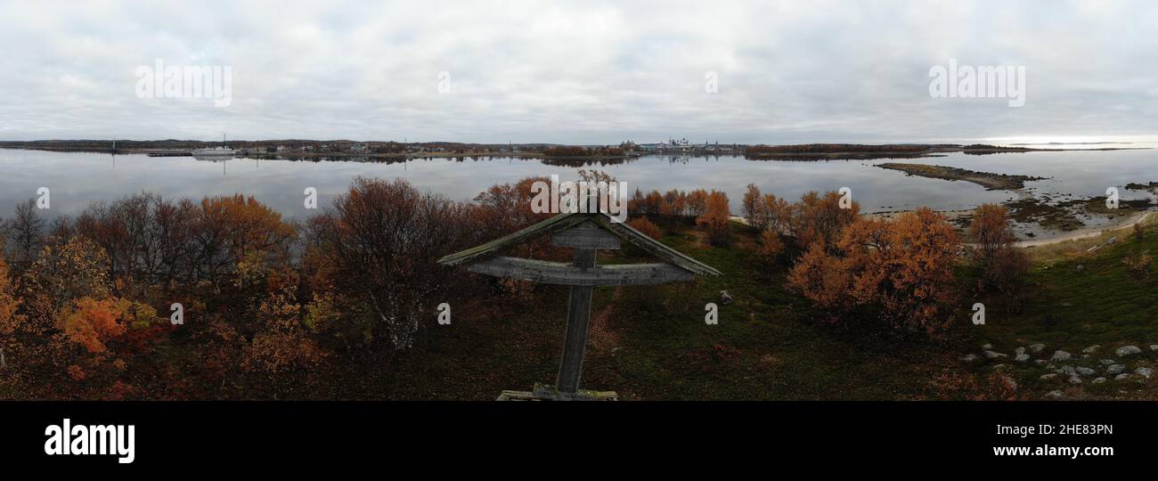 Wooden Orthodox cross and a view of the Solovetsky monastery Stock Photo