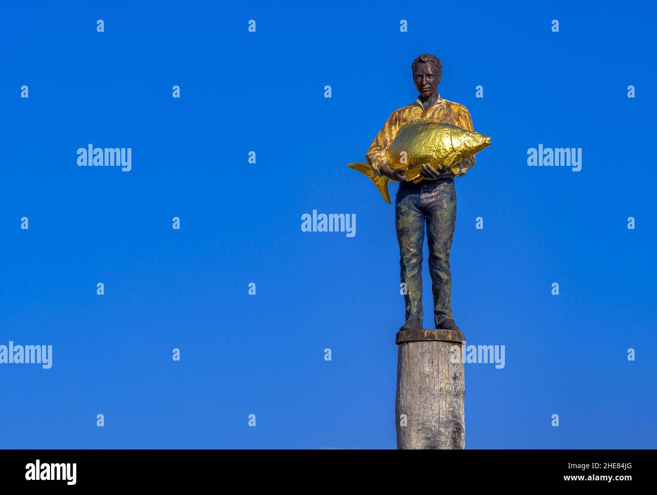 The Man with the Golden Fish, sculpture, Diessen am Ammersee, Bavaria, Germany Stock Photo