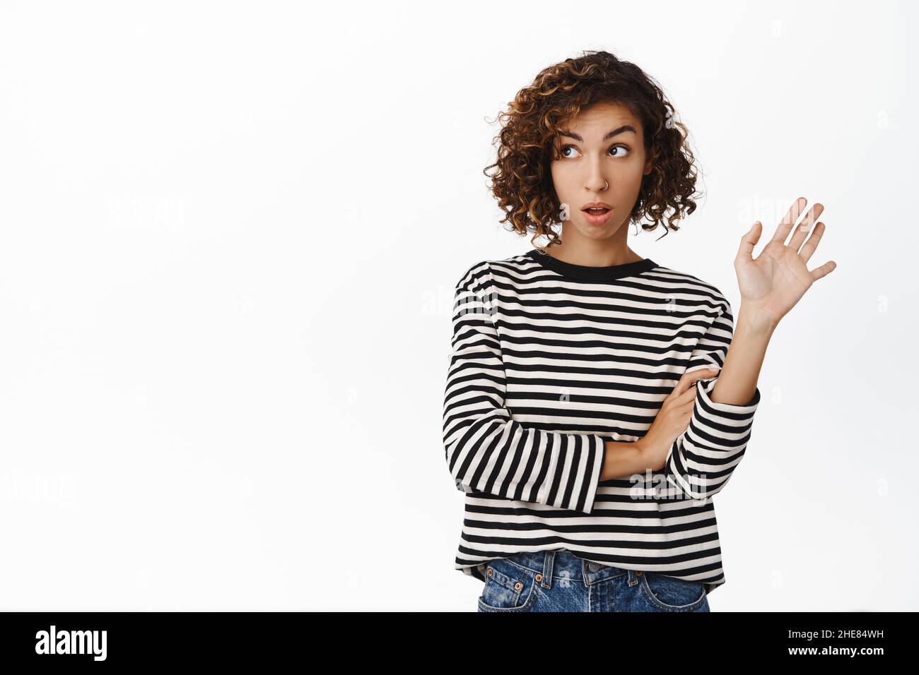 Image of annoyed, arrogant young woman wave away to reject offer ...