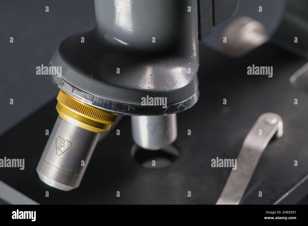 Close up of a antique two objective Masusch and Lomb microscope turret ...