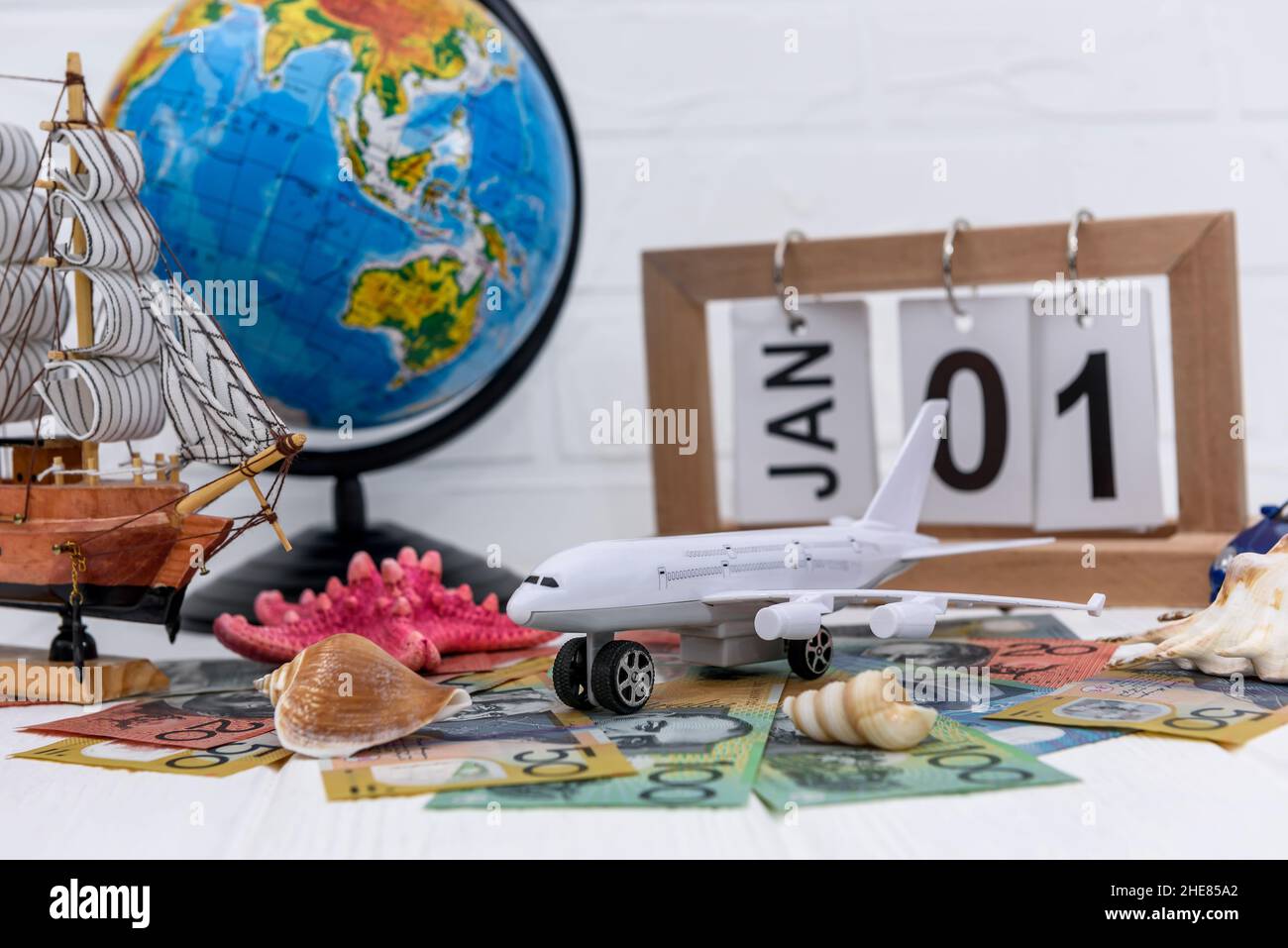 Toy airplane with globe and australian dollar banknotes Stock Photo