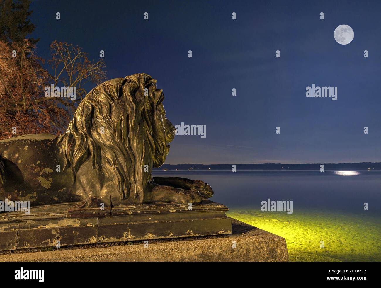 Lion sculpture on Lake Starnberg at night, Tutzing, Bavaria, Germany Stock Photo