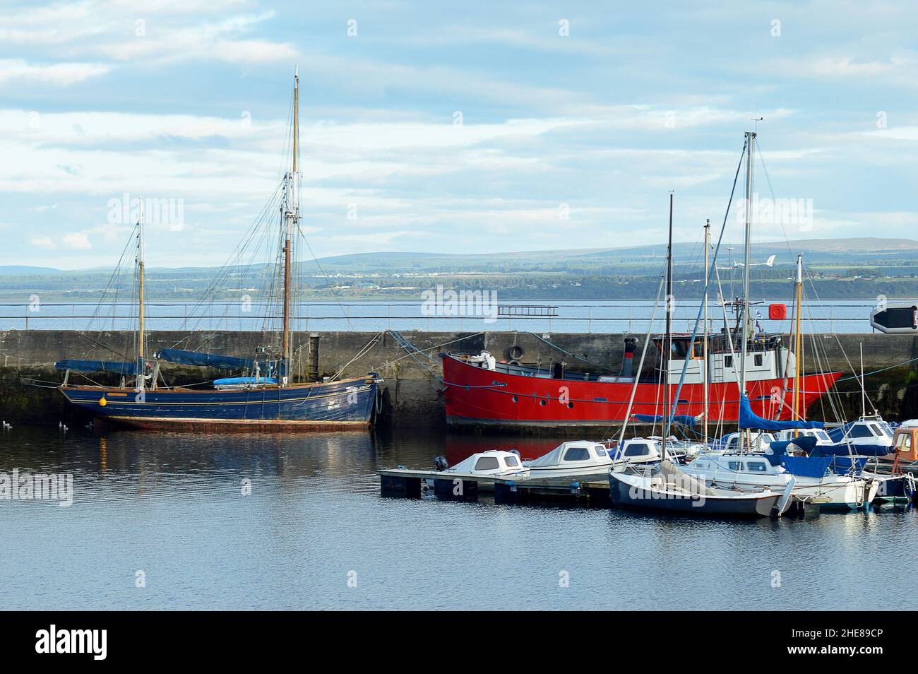 Fishing boats and pleasure craft moored at small Scottish harbour of Avoch on the Black Isle, Ross and Cromarty. Stock Photo