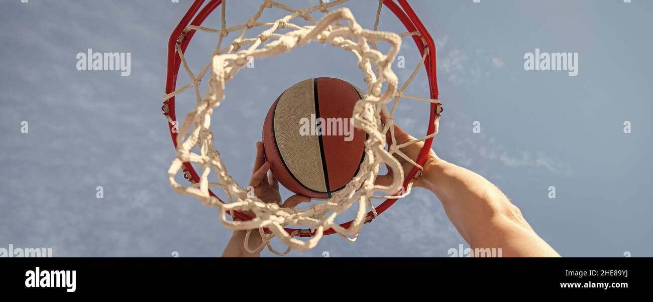 hand and basketball. dunk in basket. slam dunk in motion. professional player. Stock Photo