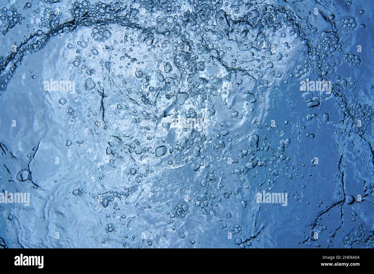 Air bubbles underwater below water surface, natural scene, Caribbean sea Stock Photo