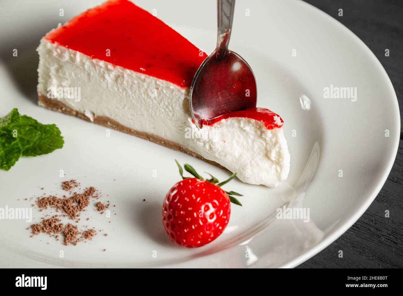 Strawberry cheesecake on a white plate. Stock Photo