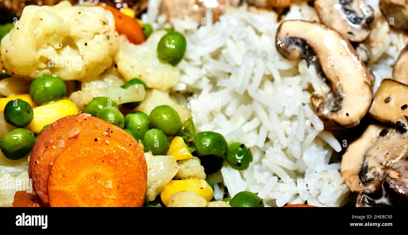 Photo of rice, carrots, peas, corn, cauliflower, and mushroom meal