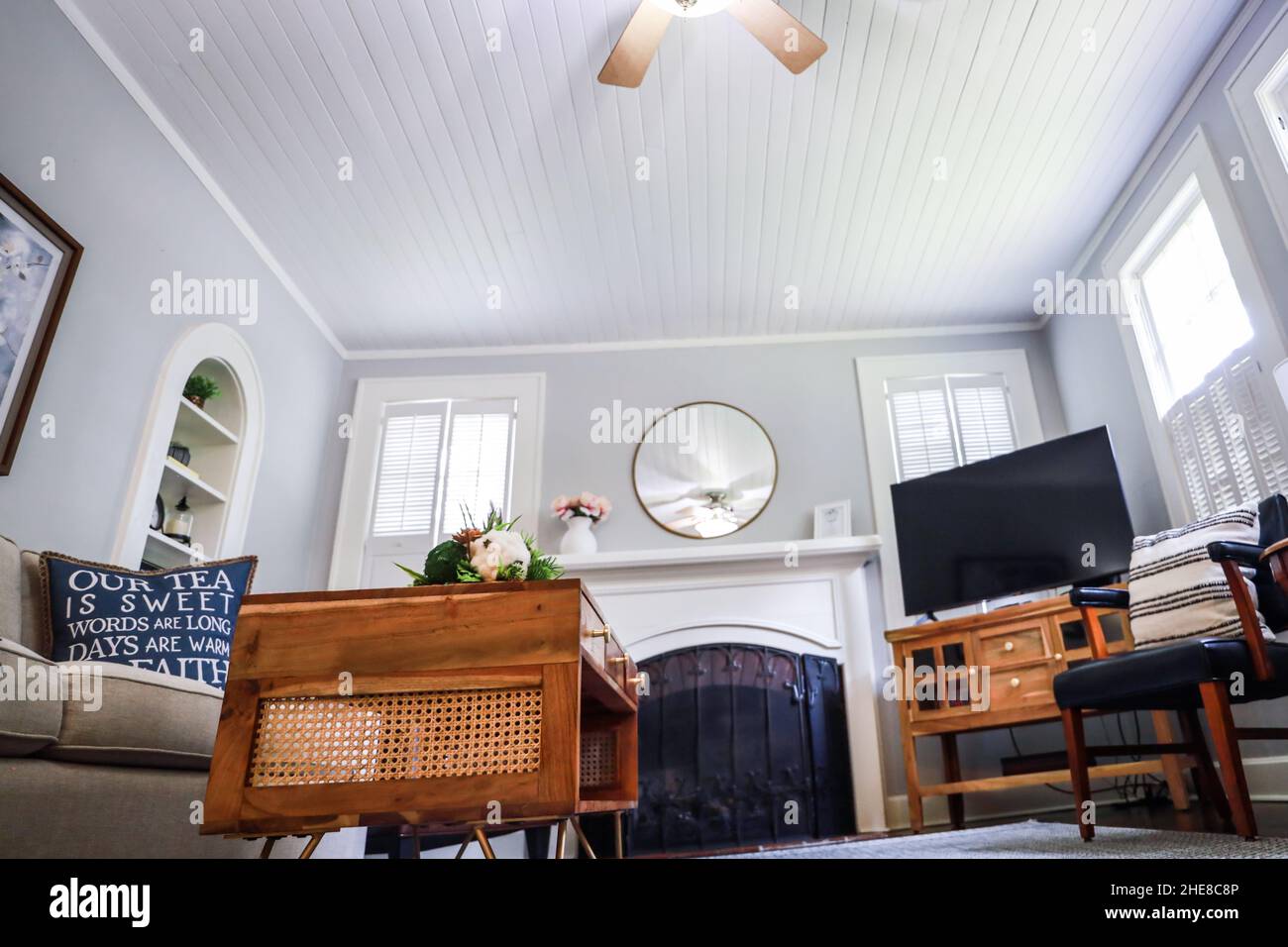 A clean and classic airy living room of a small cottage short term rental Stock Photo