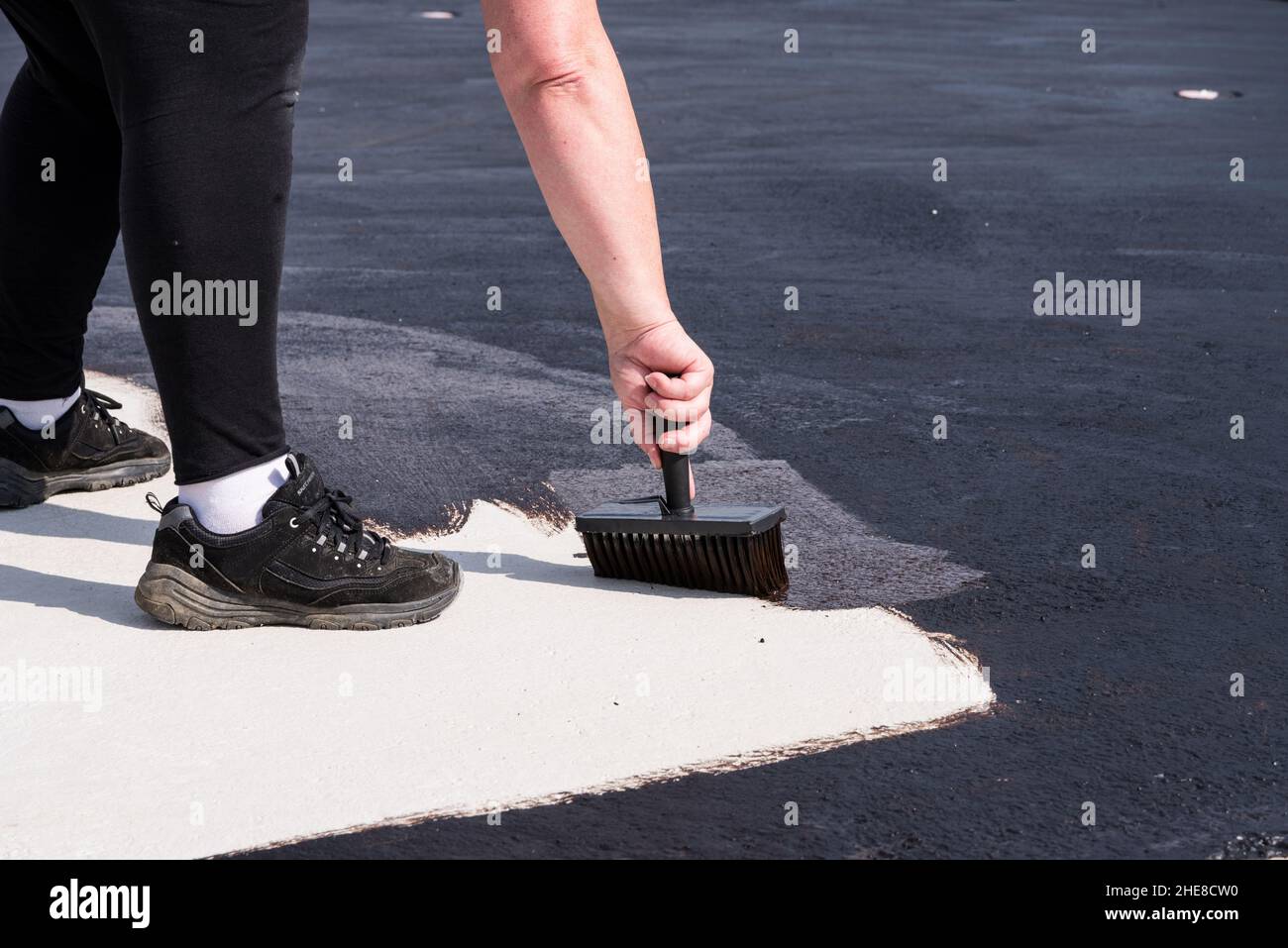 Construction Worker Paints Concrete Ceiling Waterproof With Bitumen ...