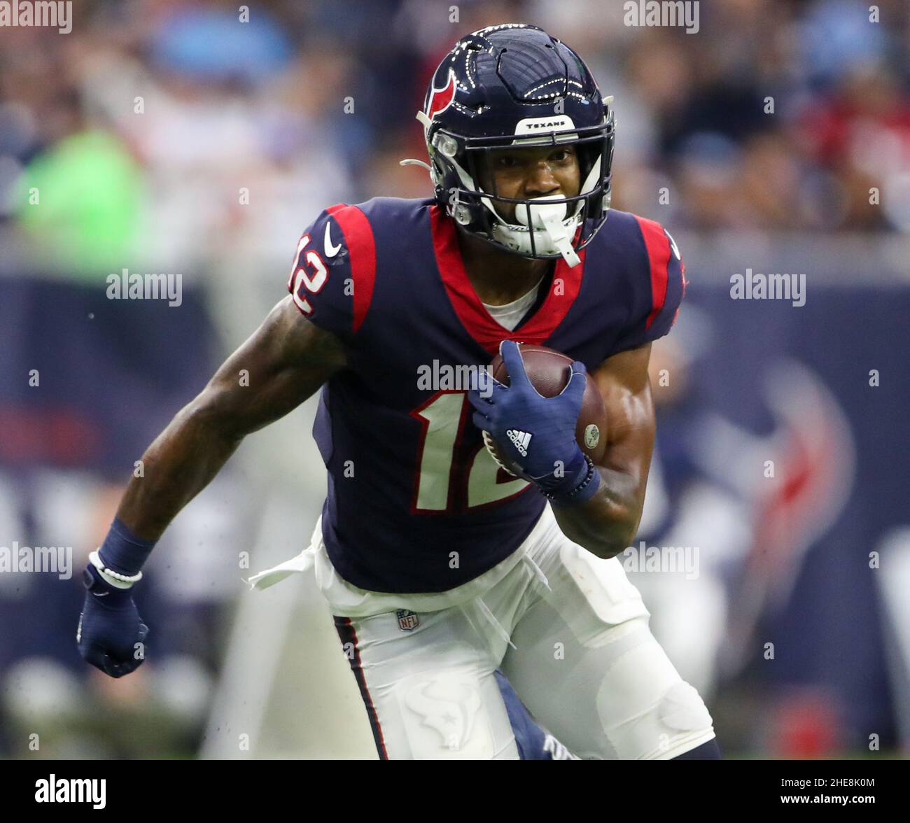 January 9, 2022: Houston Texans wide receiver Nico Collins (12) carries the  ball after a catch during an NFL game between the Texans and the Titans on  Jan. 9, 2022 in Houston,