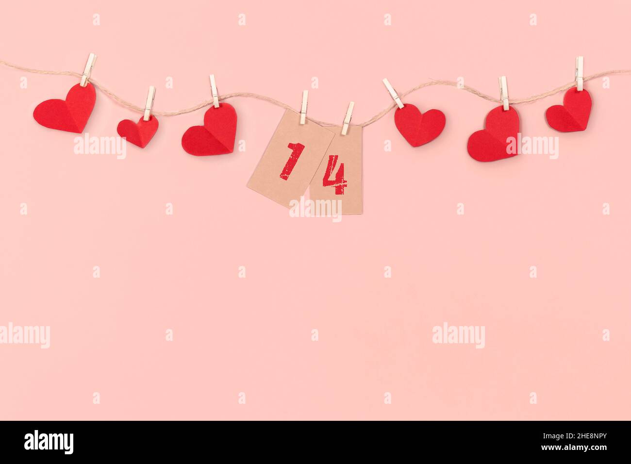 Valentines Day and Mother Day background. Red hearts on pink background. Stock Photo