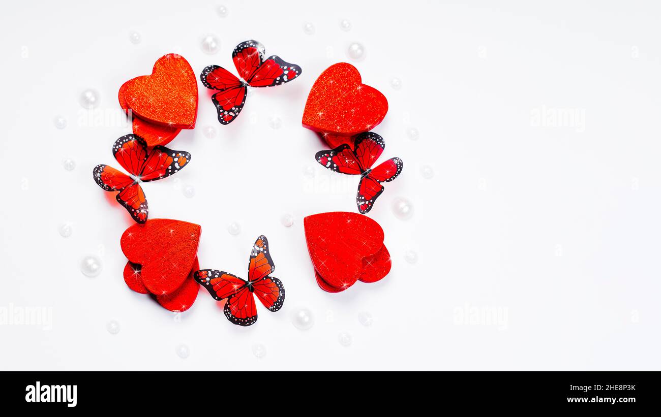 Valentine s day concept.Red hearts with butterflies on a white ...