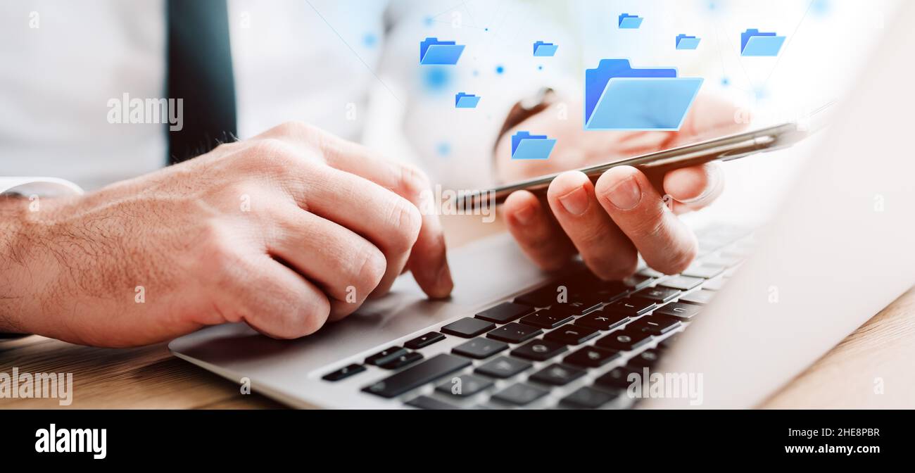 Document management system (DMS) concept, businessman using laptop and ...