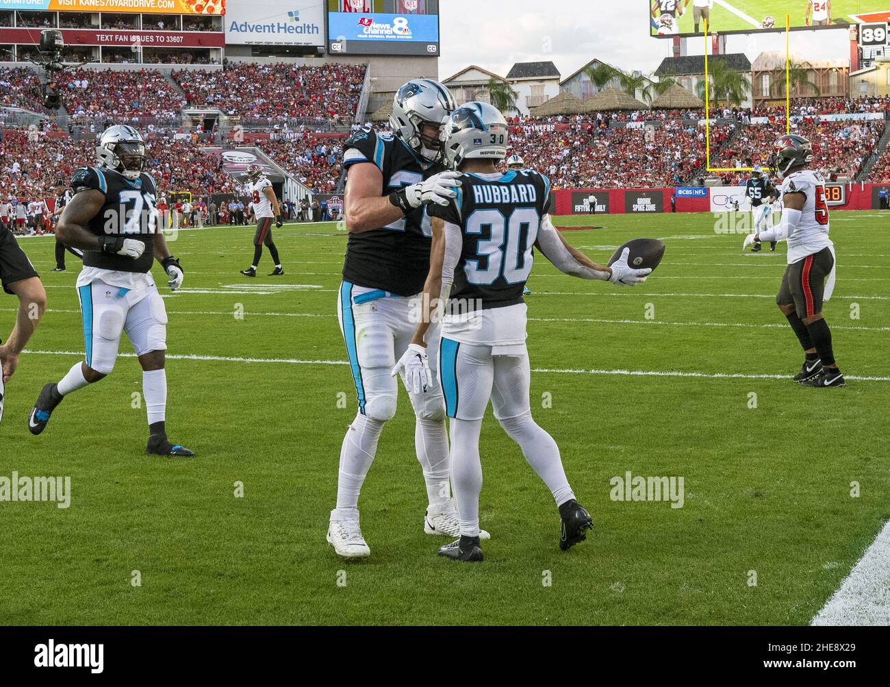 Tampa, United States. 09th Jan, 2022. Carolina Panthers' Trent Scott (78) and Brady Christensen (C) congratulate Chubba Hubbard (30) after his touchdown during the first half against the Tampa Bay Buccaneers at Raymond James Stadium in Tampa, Florida on Sunday, January 9, 2022. Photo by Steve Nesius/UPI Credit: UPI/Alamy Live News Stock Photo