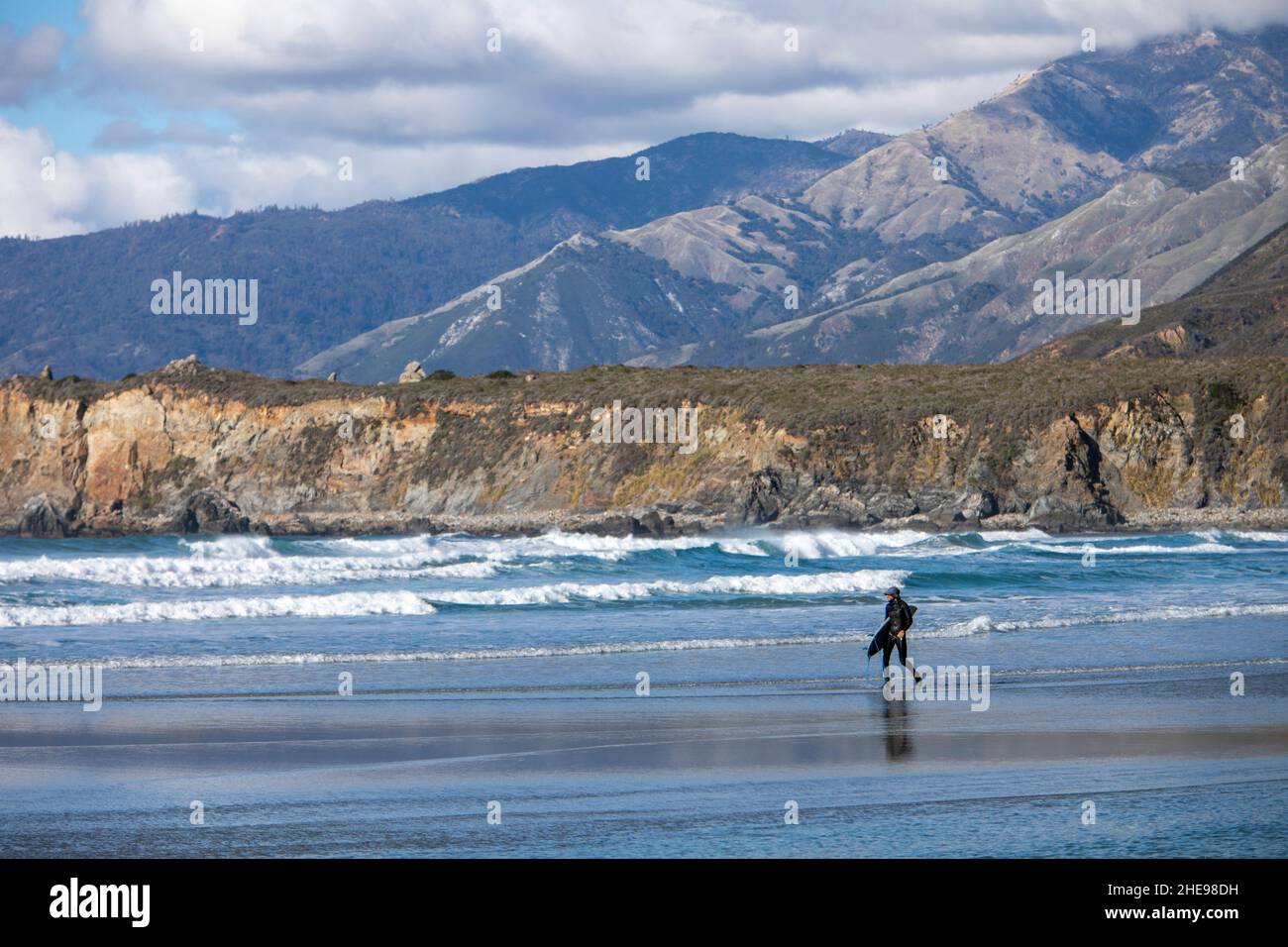 Surfer at Sand Dollar beach, southern Big Sur coast, Highway 1, California Stock Photo