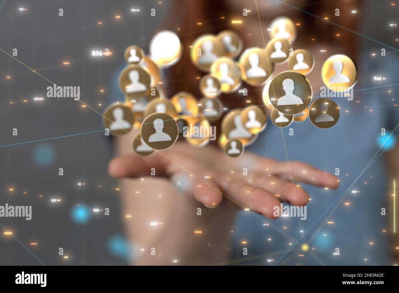 Shallow focus of a human hand holding connected human icons, team networking concept Stock Photo