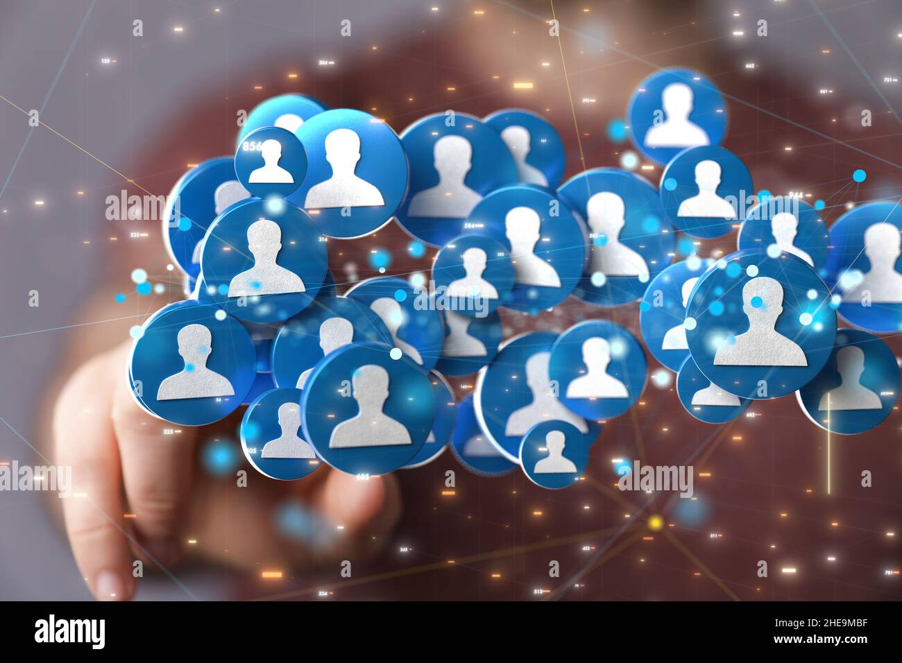 Shallow focus of a human hand pointing on human icons, team networking concept Stock Photo