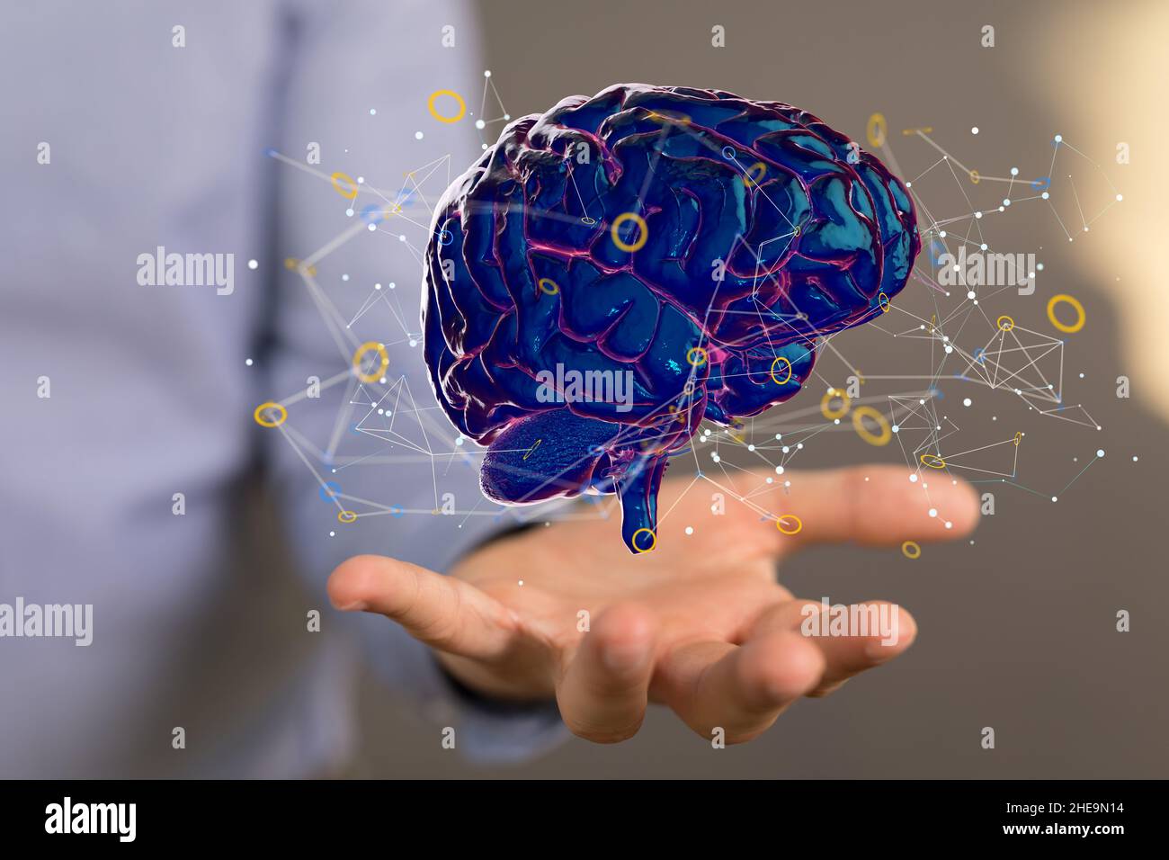 Shallow focus of a human hand holding a brain icon, artificial ...