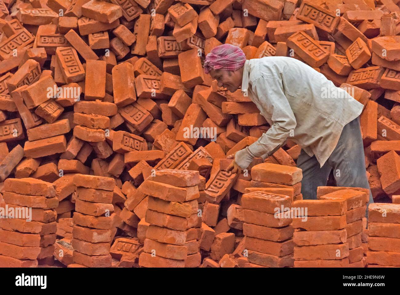 Worker laying bricks, Thimphu, Bhutan Stock Photo