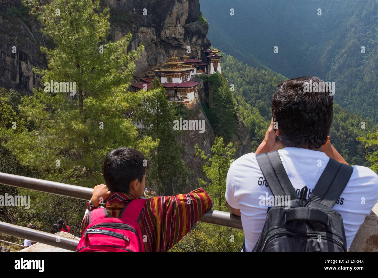 Tourists photographing Paro Taktsang (also known as Tiger's Nest), Paro, Bhutan Stock Photo