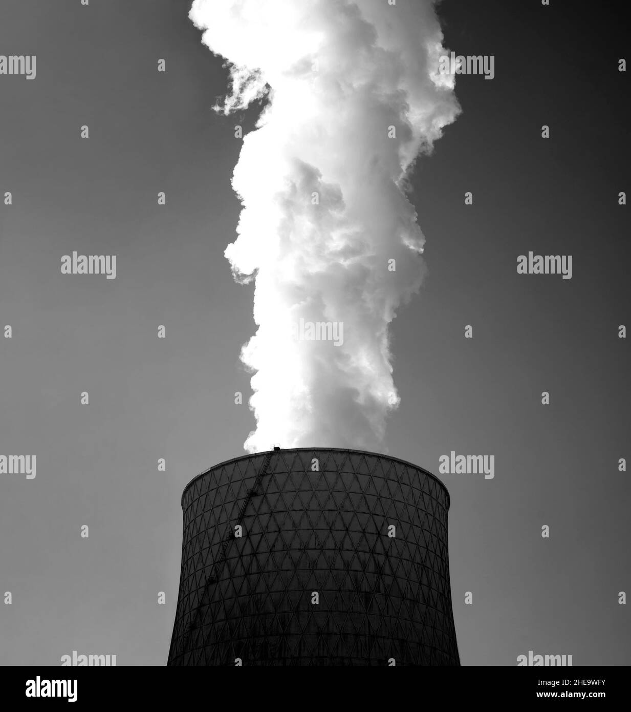 Big and toxic smoke that comes from an industrial chimney. Stock Photo