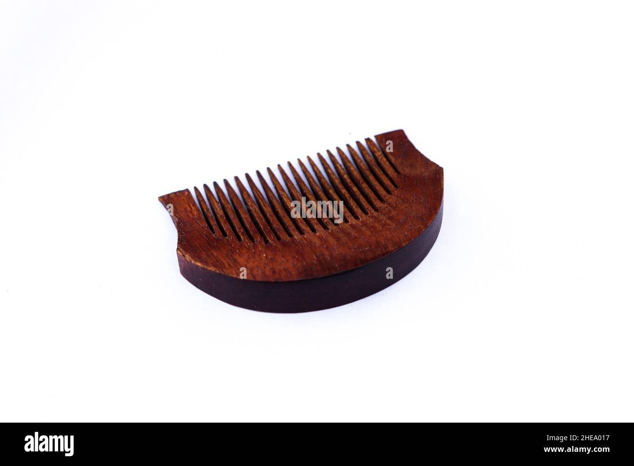 A wooden comb for hair and beard isolated on white background Stock Photo