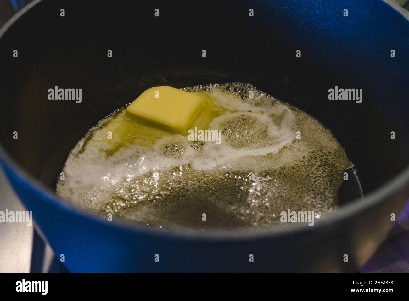 Melted butter in a hot heavy saucepan close up. Melting butter on the